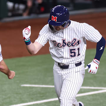 Ole Miss outfielder Isaac Humphrey rounds the bases after hitting a solo home run in a 2-1 win over the Arizona Wildcats at Globe Life Field in Arlington, Texas.