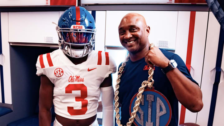 Dillon Alfred with Ole Miss Rebels wide receivers coach George McDonald.
