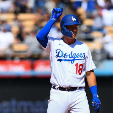 Jul 24, 2022; Los Angeles, California, USA; Los Angeles Dodgers designated hitter Jake Lamb (18) celebrates after hitting a double and earning a RBI against the San Francisco Giants during the seventh inning at Dodger Stadium. Mandatory Credit: Jonathan Hui-USA TODAY Sports