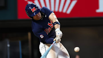 Ole Miss infielder Luke Hill swings at a pitch during a game in the Shriners Children's College Showdown in Arlington, Texas, against the Clemson Tigers.