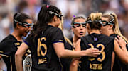 Northwestern huddles in the Women's Lacrosse National Championship Game against North Carolina on May 25, 2025.