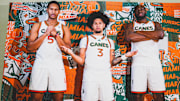 New Miami Hurricanes Seniors Malik Reneau (5), Tre Donaldson (3), and Ernest Udeh Jr. (8) are posing for media day.