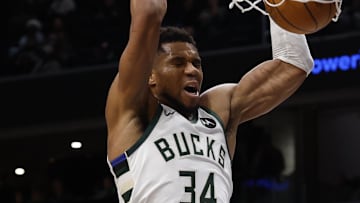 Dec 1, 2025; Washington, District of Columbia, USA; Milwaukee Bucks forward Giannis Antetokounmpo (34) dunks the ball as Washington Wizards forward Khris Middleton (22) looks on in the second quarter at Capital One Arena. Mandatory Credit: Geoff Burke-Imagn Images