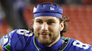 Seattle Seahawks tight end AJ Barner celebrates while leaving the field after defeating the Washington Commanders.