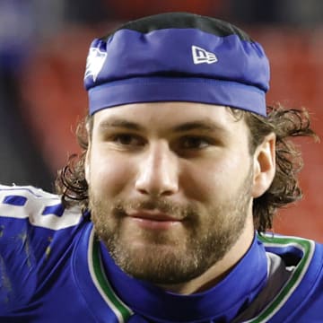Seattle Seahawks tight end AJ Barner celebrates while leaving the field after defeating the Washington Commanders.