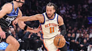 Dec 7, 2025; New York, New York, USA;  New York Knicks guard Jalen Brunson (11) looks to drive past Orlando Magic forward Franz Wagner (22) in the first quarter at Madison Square Garden. Mandatory Credit: Wendell Cruz-Imagn Images