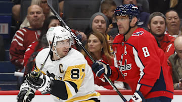 Oct 13, 2023; Washington, District of Columbia, USA; Pittsburgh Penguins center Sidney Crosby (87) and Washington Capitals left wing Alex Ovechkin (8) skate in the second period at Capital One Arena. Mandatory Credit: Geoff Burke-Imagn Images