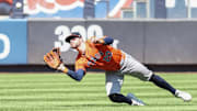 Houston Astros center fielder Chas McCormick (20) makes a diving catch in the fourth inning against the New York Yankees at Yankee Stadium. 