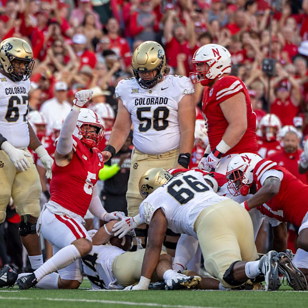 Nebraska defenders react after stopping Colorado running back Charlie Offerdahl for a loss on fourth-and-1.