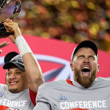 Jan. 29, 2023: Patrick Mahomes raises the Lamar Hunt Trophy while Travis Kelce celebrates after the Kansas City Chiefs' 23-20 win over the Cincinnati Bengals in the AFC championship game at Arrowhead Stadium.