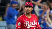 Cincinnati Reds starting pitcher Hunter Greene (21) reacts as Los Angeles Dodgers right fielder Teoscar Hernandez (37) runs the bases on a three-run home run in the third inning of the MLB National League Wild Card Game 1 between the Los Angeles Dodgers and the Cincinnati Reds at Dodger Stadium in Los Angeles on Tuesday, Sept. 30, 2025. The Dodgers won game 1 of the series, 10-5.
