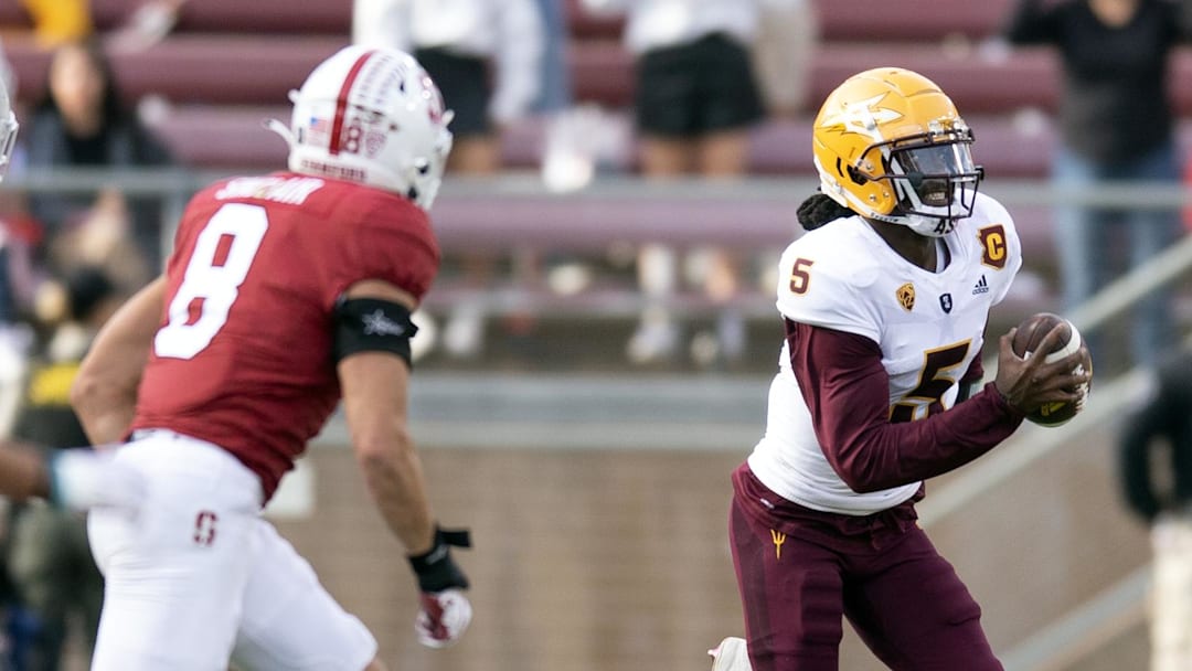 Oct 22, 2022; Stanford, California, USA; Arizona State Sun Devils quarterback Emory Jones (5) runs the ball against Stanford Cardinal defenders during the fourth quarter at Stanford Stadium. Mandatory Credit: D. Ross Cameron-Imagn Images Oct 22, 2022; Stanford, California, USA; Arizona State Sun Devils quarterback Emory Jones (5) runs the ball against Stanford Cardinal defenders during the fourth quarter at Stanford Stadium. Mandatory Credit: D. Ross Cameron-Imagn Images