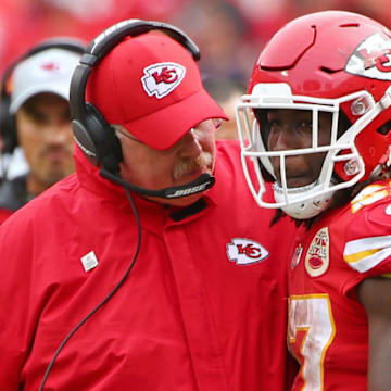 Oct 7, 2018; Kansas City, MO, USA; Kansas City Chiefs head coach Andy Reid talks with running back Kareem Hunt (27) in the second half against the Jacksonville Jaguars at Arrowhead Stadium. Mandatory Credit: Jay Biggerstaff-Imagn Images