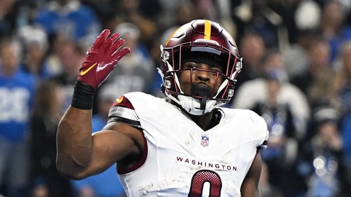 Washington Commanders running back Brian Robinson Jr. celebrates a touchdown against Detroit Lions