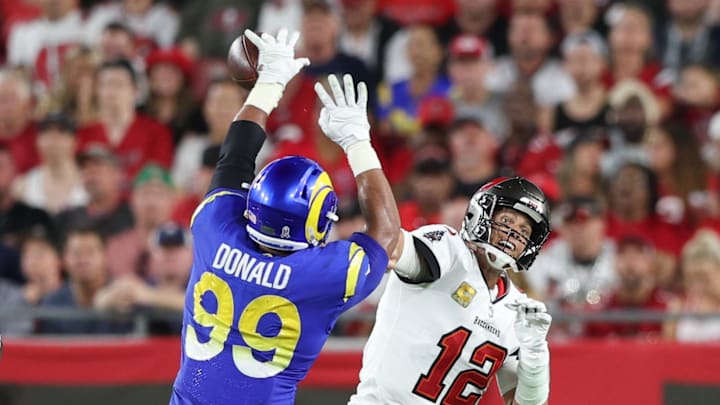Los Angeles Rams defensive tackle Aaron Donald (99) breaks up a pass by Tampa Bay Buccaneers quarterback Tom Brady.