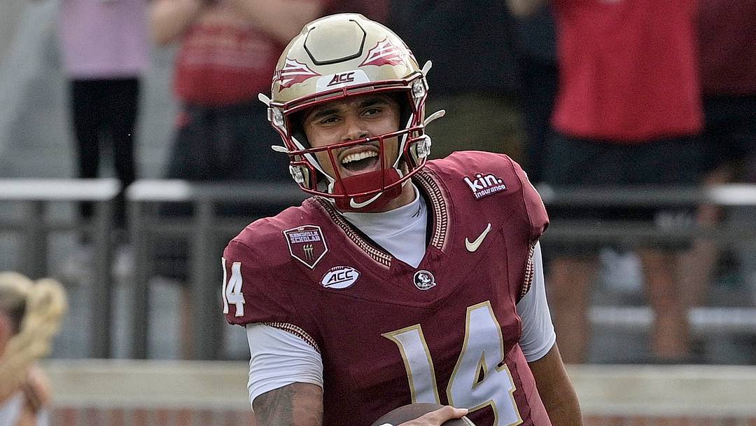 Oct 3, 2026; Tallahassee, Florida, USA;  Florida State Seminoles quarterback Ashton Daniels (14) runs for a touchdown during the second half against the Virginia Cavaliers at Doak S. Campbell Stadium.  Mandatory Credit: Melina Myers-Imagn Images