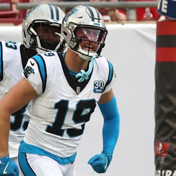 Dec 29, 2024; Tampa, Florida, USA; Carolina Panthers wide receiver Adam Thielen (19) is congratulated after he scored a touchdown against the Tampa Bay Buccaneersduring the second quarter at Raymond James Stadium. Mandatory Credit: Kim Klement Neitzel-Imagn Images