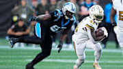 Nov 9, 2025; Charlotte, North Carolina, USA; New Orleans Saints running back Alvin Kamara (41) rushes during the fourth quarter against the Carolina Panthers at Bank of America Stadium. 