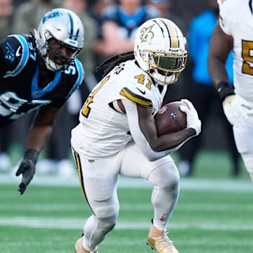 Nov 9, 2025; Charlotte, North Carolina, USA; New Orleans Saints running back Alvin Kamara (41) rushes during the fourth quarter against the Carolina Panthers at Bank of America Stadium. 