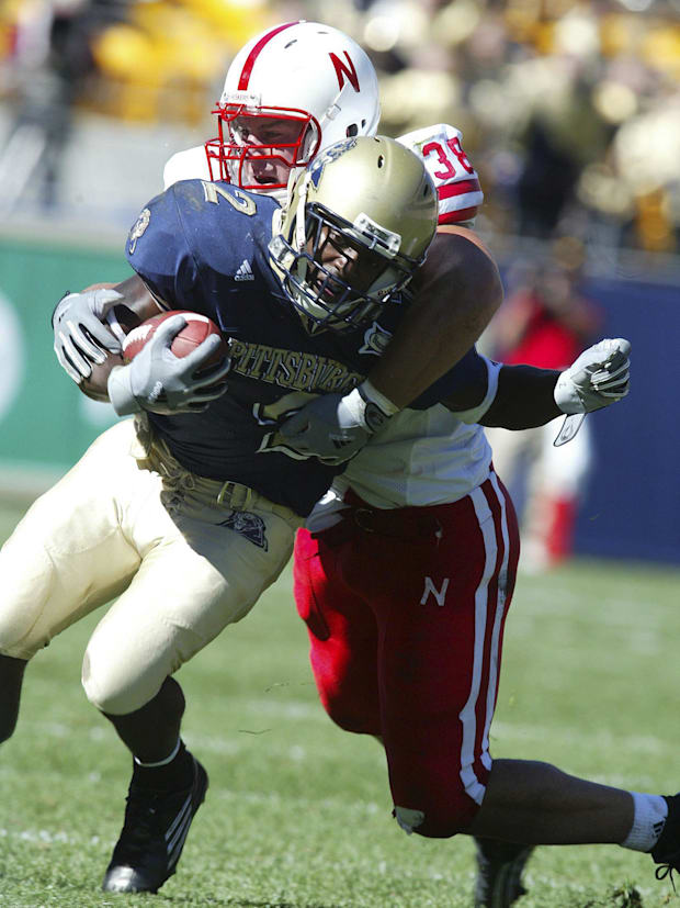 Pittsburgh's Marcus Furman gets tackled by Nebraska's Barrett Ruud in the fourth quarter at Heinz Field.