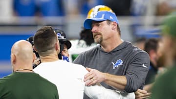 Jan 9, 2022; Detroit, Michigan, USA; Detroit Lions head coach Dan Campbell talks with Green Bay Packers head coach Matt LaFleur after the game at Ford Field. Mandatory Credit: Raj Mehta-Imagn Images