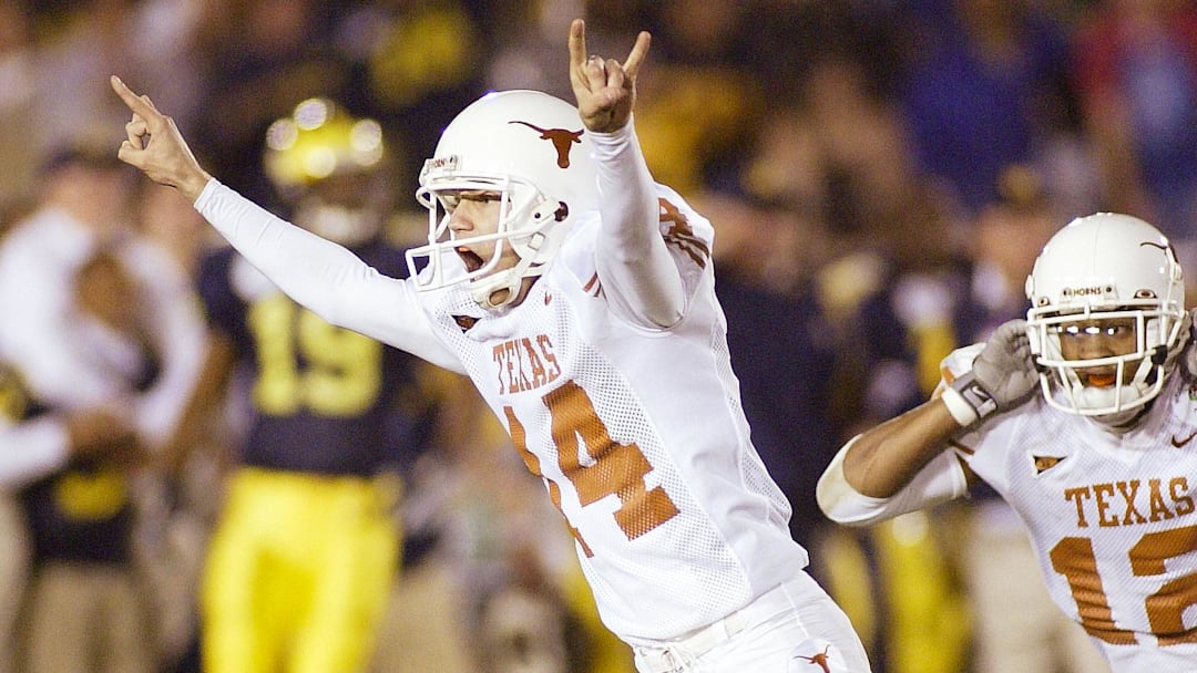 Jan 1, 2005; Pasadena, CA, USA: FILE PHOTO; Texas Longhorns kicker Dusty Mangum (14) and wide receiver Tony Jeffery (12) celebrates against the Michigan Wolverines Texas Longhorns during the 2005 Rose Bowl at the Rose Bowl. The Longhorns defeated the Wolverines 38-37. Mandatory Credit: Richard Mackson-USA TODAY Network