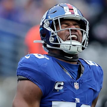 Dec 31, 2023; East Rutherford, New Jersey, USA; New York Giants linebacker Bobby Okereke (58) celebrates his sack against the Los Angeles Rams during the second quarter at MetLife Stadium. Mandatory Credit: Brad Penner-Imagn Images