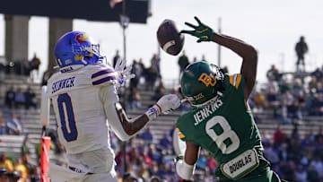 Nov 30, 2024; Waco, Texas, USA;  Baylor Bears cornerback Caden Jenkins (8) breaks up a pass intended for Kansas Jayhawks wide receiver Quentin Skinner (0) during the second half at McLane Stadium. Mandatory Credit: Chris Jones-Imagn Images