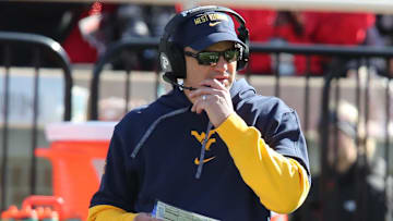 Nov 30, 2024; Lubbock, Texas, USA;  West Virginia Mountaineers head coach Neal Brown on the sidelines in the first half during the game against the Texas Tech Red Raiders at Jones AT&T Stadium and Cody Campbell Field. Mandatory Credit: Michael C. Johnson-Imagn Images