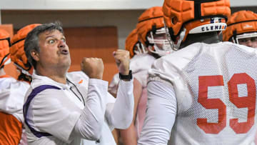 Clemson offensive line coach Matt Luke works with offensive lineman Dietrick Pennington (59) during the first day of Spring practice at the Poe Indoor Practice Facility at the Allen N. Reeves football complex in Clemson S.C. Wednesday, February 28, 2024.