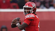 Utah Utes quarterback Devon Dampier (4) looks to pass against the Cal Poly Mustangs during the first quarter at Rice-Eccles Stadium.