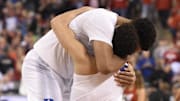 Apr 6, 2015; Indianapolis, IN, USA; Duke Blue Devils guard Tyus Jones (5) celebrates with center Jahlil Okafor (15) as Duke defeats Wisconsin Badgers 68-63 in the 2015 NCAA Men's Division I Championship game at Lucas Oil Stadium. Mandatory Credit: Robert Deutsch-Imagn Images