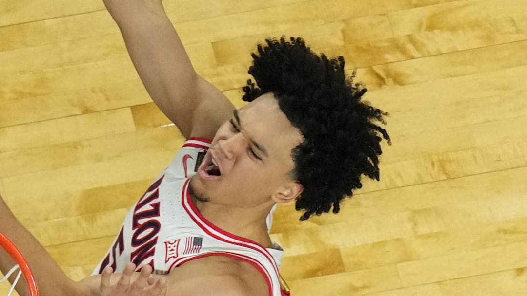 Apr 4, 2026; Indianapolis, IN, USA; Arizona Wildcats guard Brayden Burries (5) shoots against Michigan Wolverines center Aday Mara (15) in the second half during a semifinal of the Final Four of the men's 2026 NCAA Tournament at Lucas Oil Stadium. Mandatory Credit: Robert Deutsch-Imagn Images