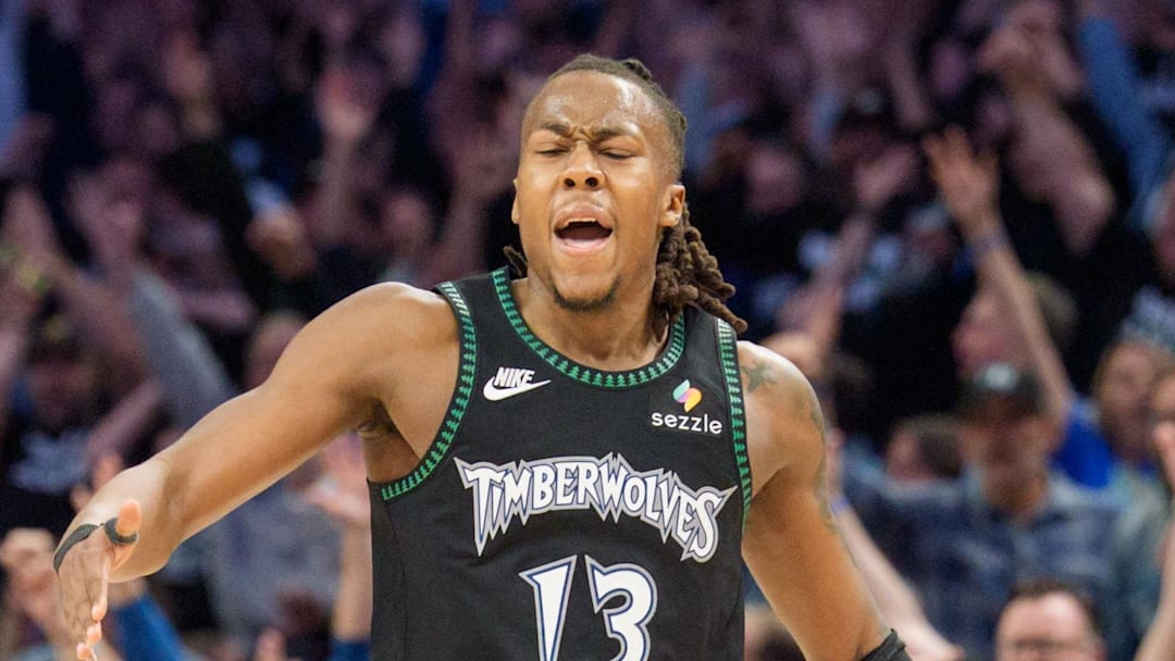 Apr 25, 2026; Minneapolis, Minnesota, USA; Minnesota Timberwolves guard Ayo Dosunmu (13) celebrates with fans after making a three-point shot against the Denver Nuggets in the fourth quarter at Target Center. Mandatory Credit: Matt Blewett-Imagn Images