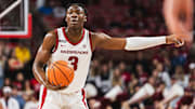 Adou Thiero (3) directs traffic with the ball in his hands against the Pacific Tigers. The Razorbacks won 91-72.