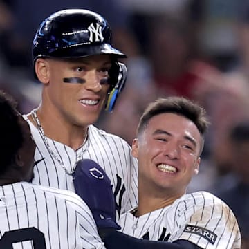 Jazz Chisholm Jr., Aaron Judge and Anthony Volpe (left to right) celebrate Judge's walk-off sacrifice fly against the Mariners Thursday.