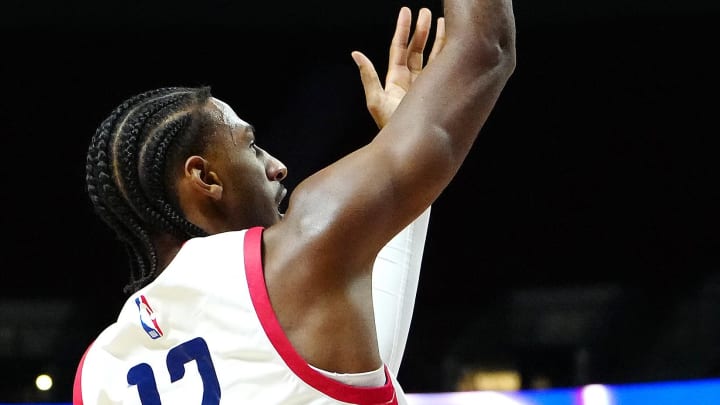 Jul 14, 2024; Las Vegas, NV, USA; Washington Wizards forward Alex Sarr (12) shoots against the Houston Rockets during the first quarter at Thomas & Mack Center. Mandatory Credit: Stephen R. Sylvanie-USA TODAY Sports