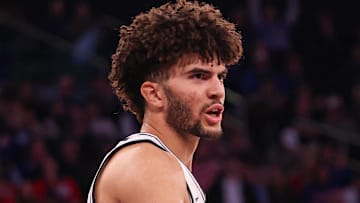 Nov 18, 2025; New York, New York, USA; Duke Blue Devils forward Cameron Boozer (12) slaps hands with d7#2 after a basket against the Kansas Jayhawks during the second half at Madison Square Garden. Mandatory Credit: Vincent Carchietta-Imagn Images