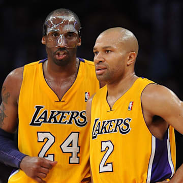 March 2, 2012; Los Angeles, CA, USA; Los Angeles Lakers shooting guard Kobe Bryant (24) talks with Los Angeles Lakers point guard Derek Fisher (2) during the second half of the game against the Sacramento Kings at the Staples Center. Mandatory Credit: Jayne Kamin-Oncea-Imagn Images