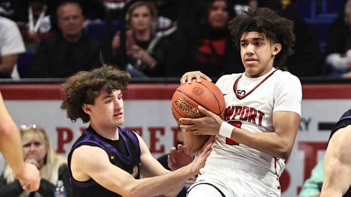 Newport guard Taylen Kinney(0) battles Campbell County guard Xavier Fancher (13) for a rebound during their Kentucky High School Athletic Association Sweet 16 game at Rupp Arena Thursday, March 21, 2024.