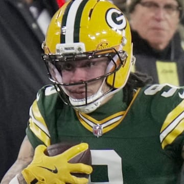 Green Bay Packers wide receiver Christian Watson (9) makes a reception for a first down against the Eagles.