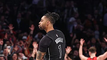 Feb 4, 2025; Brooklyn, New York, USA; Brooklyn Nets guard D'Angelo Russell (1) reacts after makes a three point basket during the fourth quarter against the Houston Rockets at Barclays Center. Mandatory Credit: Vincent Carchietta-Imagn Images