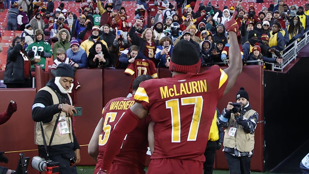Dec 22, 2024; Landover, Maryland, USA; Washington Commanders wide receiver Terry McLaurin (17) celebrates while leaving the field with Commanders linebacker Bobby Wagner (54) after their game against the Philadelphia Eagles at Northwest Stadium. Mandatory Credit: Geoff Burke-Imagn Images