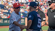 Arkansas Razorbacks head coach Dave Van Horn and Ole Miss Rebels head coach Mike Bianco meet before the game at Charles Schwab Field. 