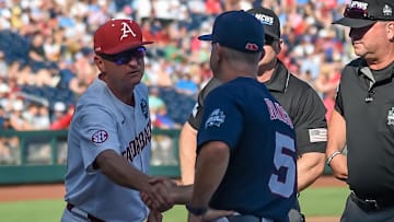 Arkansas Razorbacks head coach Dave Van Horn and Ole Miss Rebels head coach Mike Bianco meet before the game at Charles Schwab Field. 