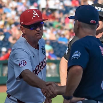 Arkansas Razorbacks head coach Dave Van Horn and Ole Miss Rebels head coach Mike Bianco meet before the game at Charles Schwab Field. 