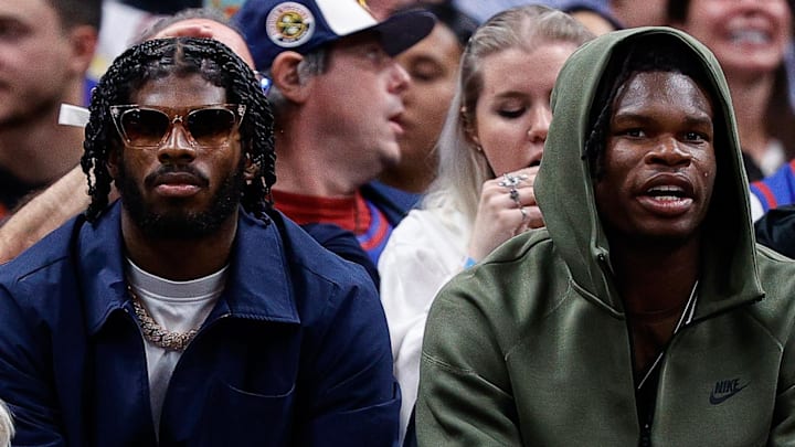 Oct 24, 2023; Denver, Colorado, USA; University of Colorado Buffaloes football players Shedeur Sanders (L) and Travis Hunter (R) watch during the third period between the Denver Nuggets and the Los Angeles Lakers at Ball Arena. Mandatory Credit: Isaiah J. Downing-Imagn Images