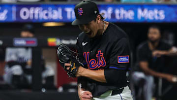 Aug 29, 2025; New York City, New York, USA; New York Mets starting pitcher Jonah Tong (21) reacts after striking out Miami Marlins catcher Liam Hicks (not pictured) to end the top of the fifth inning at Citi Field. Mandatory Credit: Vincent Carchietta-Imagn Images