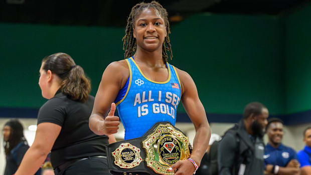 Morgan Turner celebrates her 225 112-pound Super 32 title.