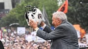Lee Corso raises a South Carolina helmet before live broadcast during ESPN Gameday near Williams-Brice Stadium in Columbia, S.C.Saturday, September 14, 2024.